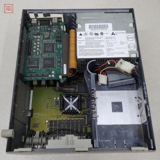 The inside of the same Quadra 700 revealing a PowerMac 7100 motherboard crammed inside it