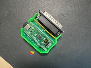 A circuitboard inside a green 3D-printed plastic case