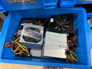 A blue bin full of random ATX power supplies