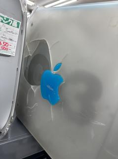 The side of a PowerMac G3 revealing a large chunk of missing plastic 