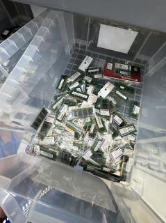 A clear plastic drawer full of SODIMM RAM sticks with price tags in the rage of 100-300 yen