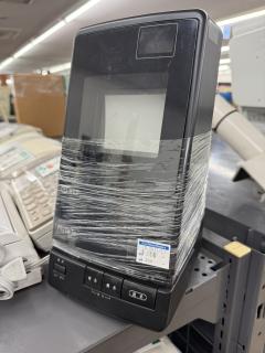A black thing with a vertical reflection CRT and some view and send buttons