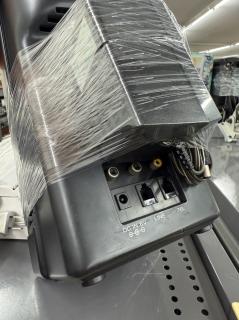 Rear of the black device with DC in, RCA and phone jacks