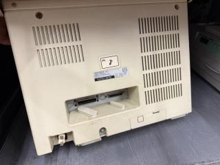 Rear showing printer (parallel) and “回線(line) ports.There is also a plastic removable plate marked モデムカード(modem card)
