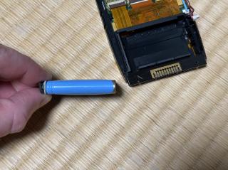 Battery side profile. Slightly puffy.
