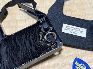 Deteriorated (and mouldy?) rubber foam rollers inside a ribbon cartridge