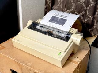 ImageWriter II printing out an article from The Onion with the headline: New Apple CEO: I'm thinking printers