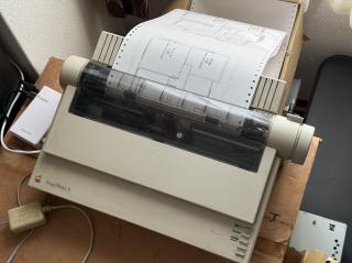 An Apple ImageWriter printing out a blueprint