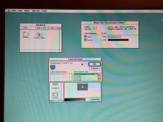 A screenshot of System 6 showing a control panel window with a resolution picker revealing the graphics card is called GrandVimage 21i A21B V1.2.0. The color selection shows a smooth gradient without any banding.