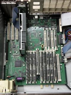 The motherboard of a PowerMac 7600 revealing an intact Tadiran battery 