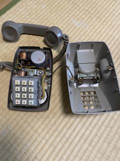 An old bakelite touch-tone phone opened up