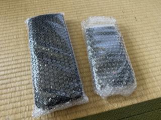 A newton messagepad and keyboard wrapped in bubble wrap on a tatami floor