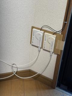 Two fiber ports, now instead of dangling are stuck to a pice of cardboard and have been labeled NTT フレッツ　光クロス and 光ネクスト