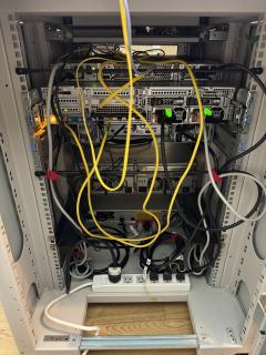 The rear of the rack showing a mess of cables