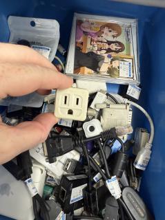 A female grounded plug with a screw terminal on the side