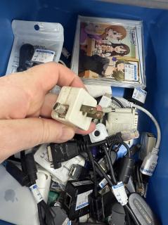 The reverse, revealing an ungrounded male plug