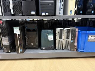 Shelves of old PCs of dubious value.In the middle is a SiliconGraphics O2