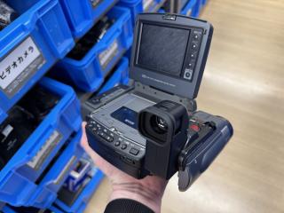 The other side of the device revealing the tape deck and lots of buttons for tape control. The LCD is revealed to be suffering from severe vinegar syndrome.