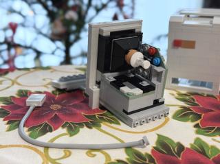 The rear inside of the machine, showing a blocky CRT neck, logic board and analog board