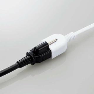 The extension cord in use, you can see the exposed earth prong