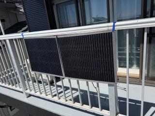 A solar panel strapped to a balcony