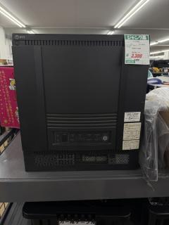 A very large black box with the NTT logo in the top left corner, a bunch of status lights in the bottom, and battery replacement stickers in the bottom right.