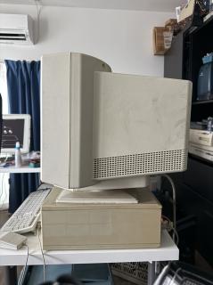 A big CRT onto of a diminutive Macintosh IIcx, side view