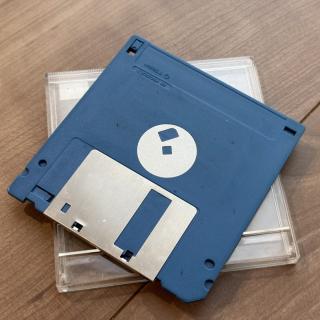 The bottom of a blue floppy disk.The spindle looks suspiciously flat