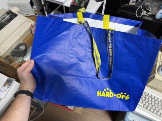 A blue carry bag with the HARD OFF logo in yellow