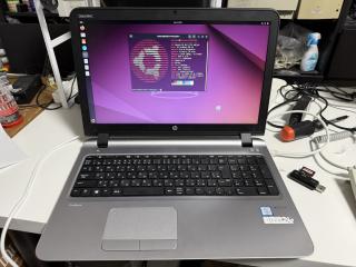 A very PC looking laptop complete with crappy offset trackpad. Above the top left of the screen it says Made in TokyoIt is showing neofetch on Ubuntu revealing HP ProBook 450 G3, Intel i3-6100U, Skylake GT2 HD Graphics, 16 GB RAM